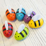 PlanToys Replacement Bees for bee hives in rainbow colours. 
