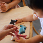 A child playing withthe PlanToys Sea Life Puzzle.