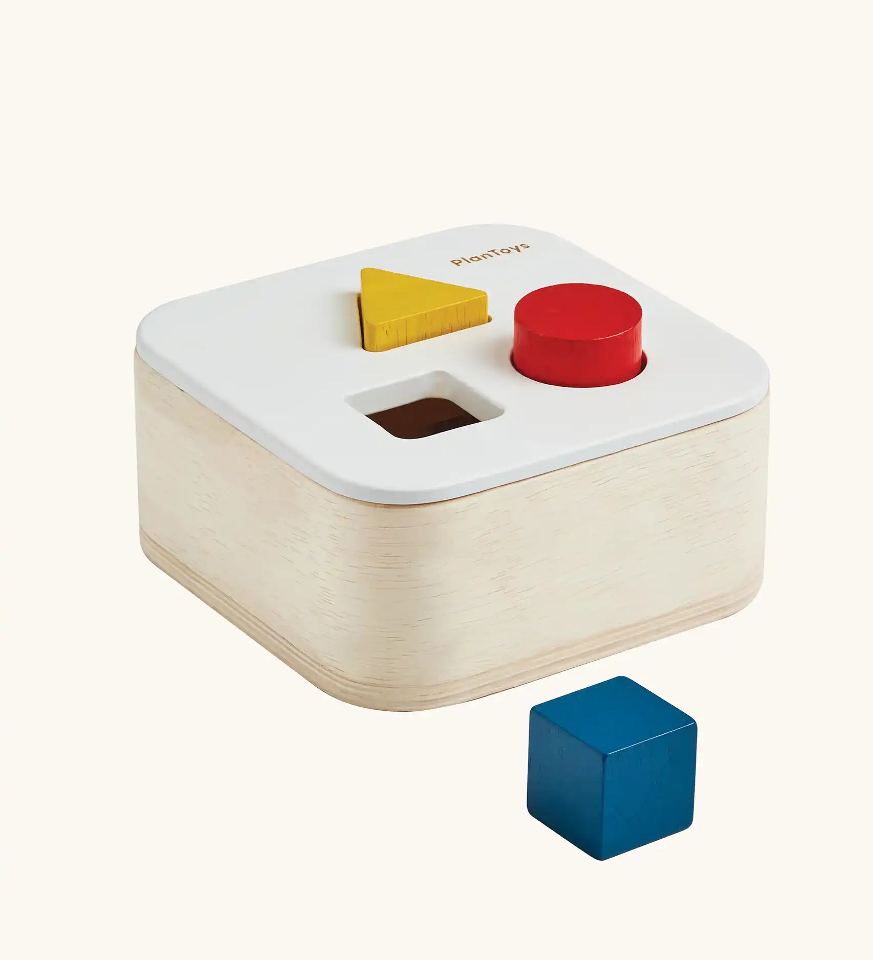 PlanToys shape and sort it out bin wooden shape sorter toy. Square box with lid with three shaped holes in the lid. Yellow triangle, red cylinder and blue cube blocks.
