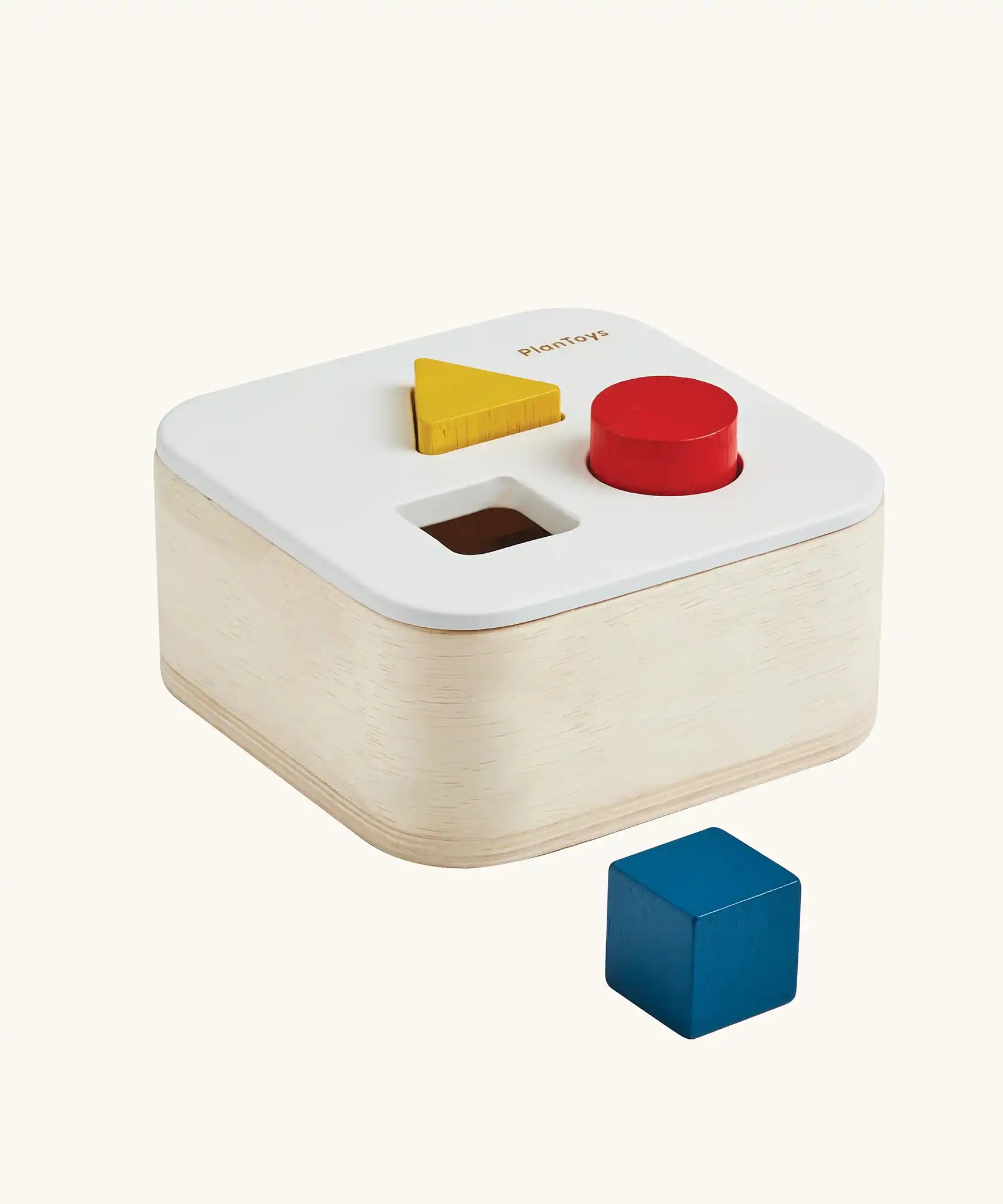 PlanToys shape and sort it out bin wooden shape sorter toy. Square box with lid with three shaped holes in the lid. Yellow triangle, red cylinder and blue cube blocks.