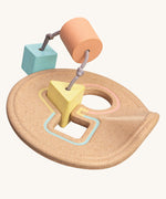 The PlanToys Shape Sorter in pastel shades on a plain background. 
