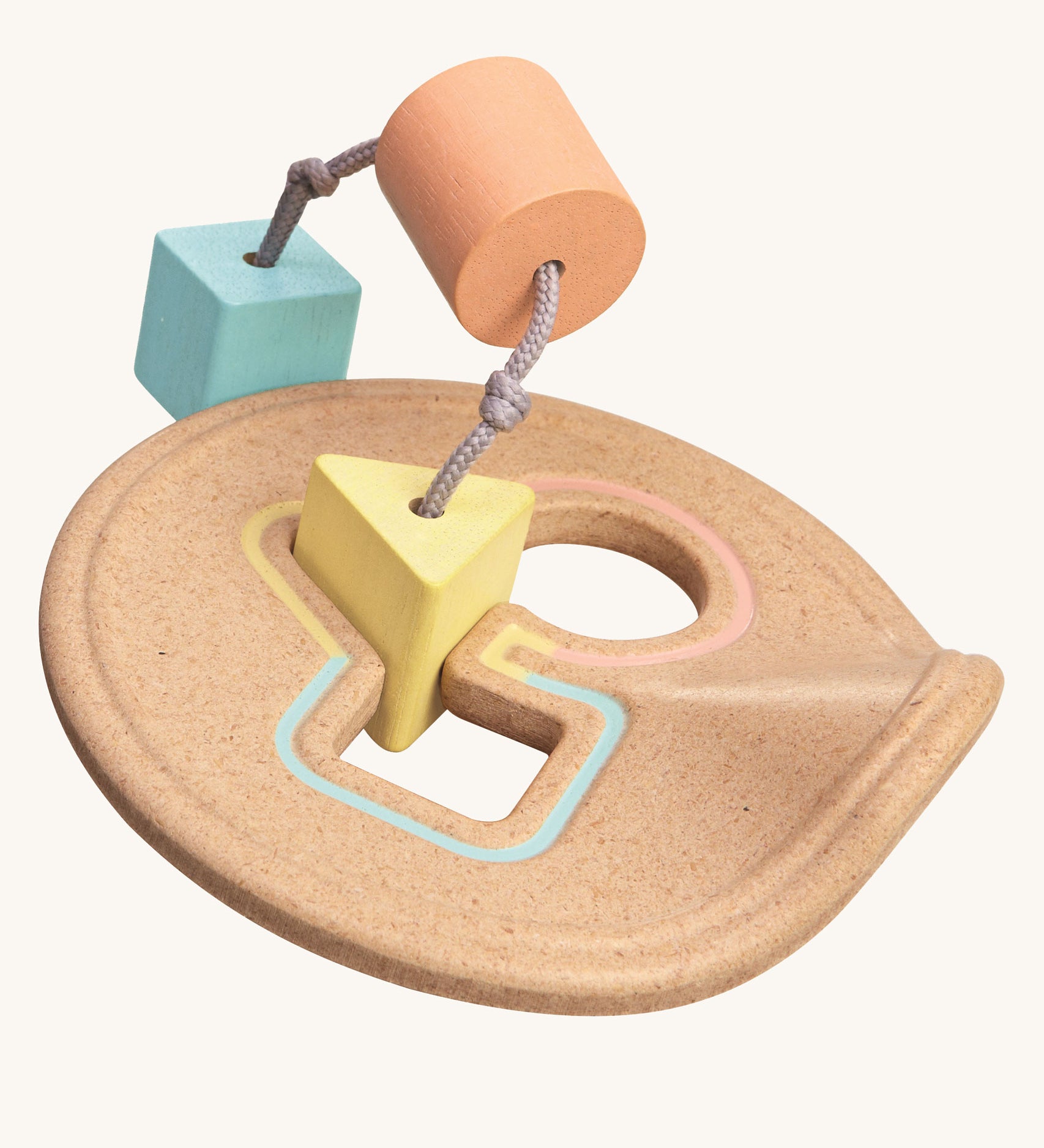 The PlanToys Shape Sorter in pastel shades on a plain background. 