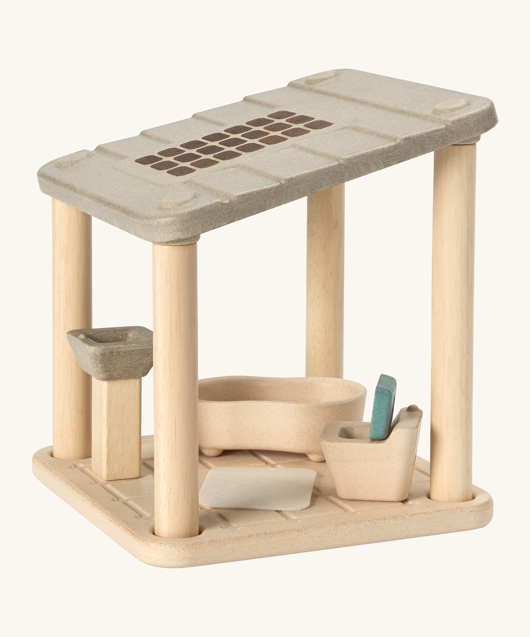 PlanToys wooden space bathroom set. Features a toy sink, bath, toilet and small rug. 