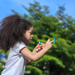 child playing with the PlanToys Spin N Fly Airplane