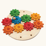 PlanToys spinning gear wooden toy playset. Wooden base with 9 coloured gears.