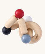 PlanToys Square Clutcher wooden baby toy. A square stretchy shape made of wooden pieces and white, grey, black and red coloured balls. PlanToys range of toys are made from sustainably sourced rubberwood, we're proud stockists of PlanToys here at Babipur. 