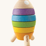 The PlanToys Stacking Rocket toy on a plain background. 
