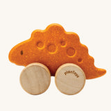 PlanToys Stego Dino wooden Car toy. A yellow coloured stegosaurus dinosaur figures on wheels. PlanToys range of toys are made from sustainably sourced rubberwood, we're proud stockists of PlanToys here at Babipur. 