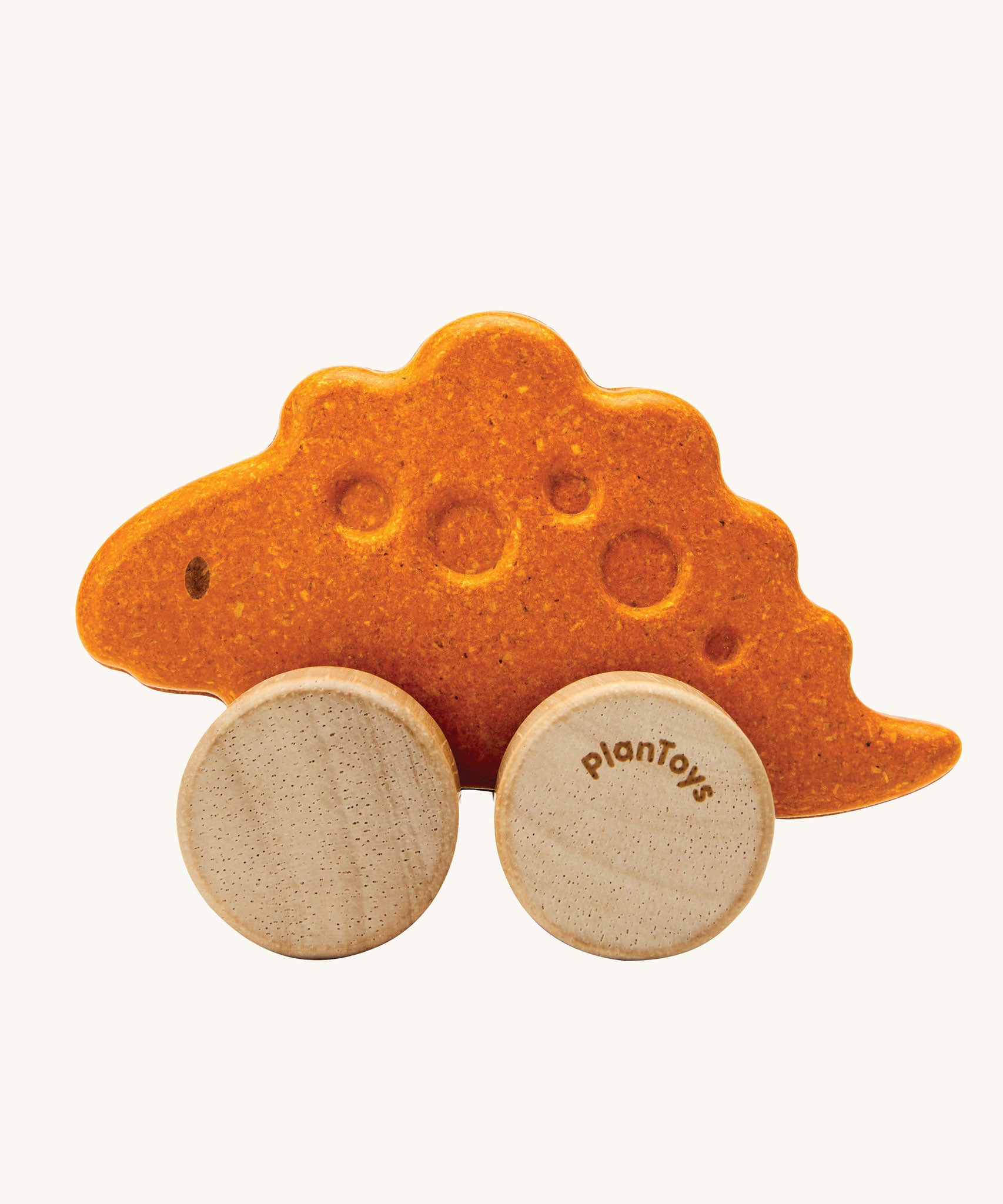 PlanToys Stego Dino wooden Car toy. A yellow coloured stegosaurus dinosaur figures on wheels. PlanToys range of toys are made from sustainably sourced rubberwood, we're proud stockists of PlanToys here at Babipur. 