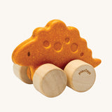 PlanToys Stego Dino wooden Car toy. A yellow coloured stegosaurus dinosaur figures on wheels. PlanToys range of toys are made from sustainably sourced rubberwood, we're proud stockists of PlanToys here at Babipur. 