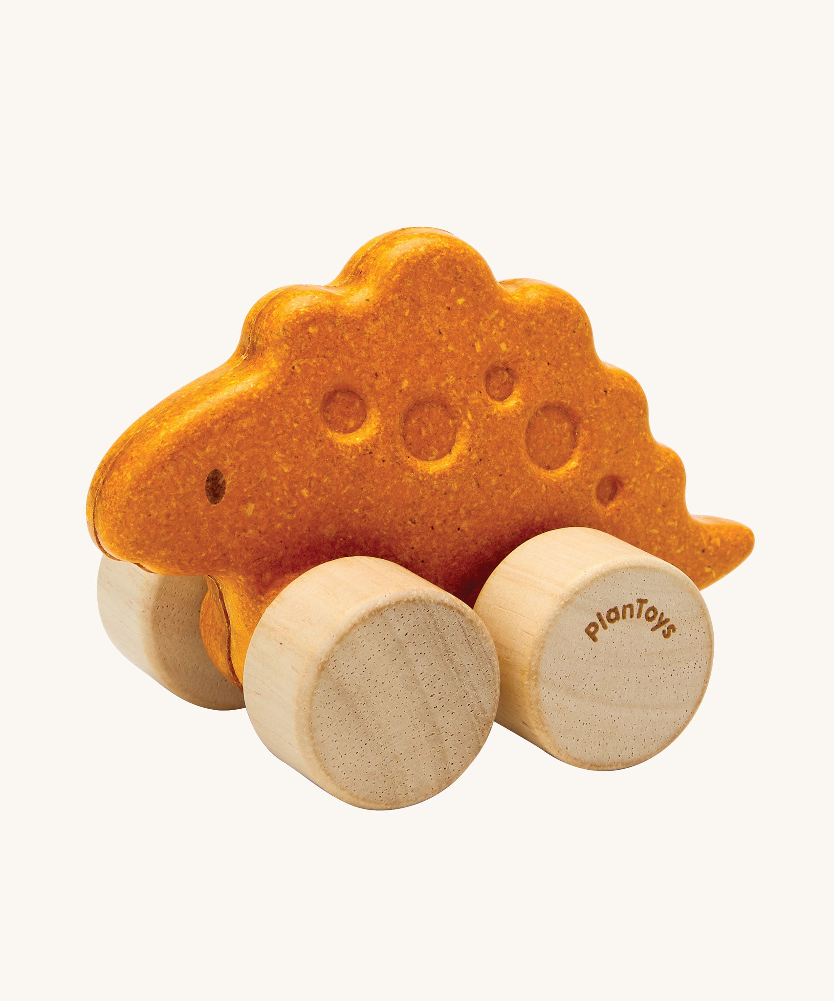 PlanToys Stego Dino wooden Car toy. A yellow coloured stegosaurus dinosaur figures on wheels. PlanToys range of toys are made from sustainably sourced rubberwood, we're proud stockists of PlanToys here at Babipur. 