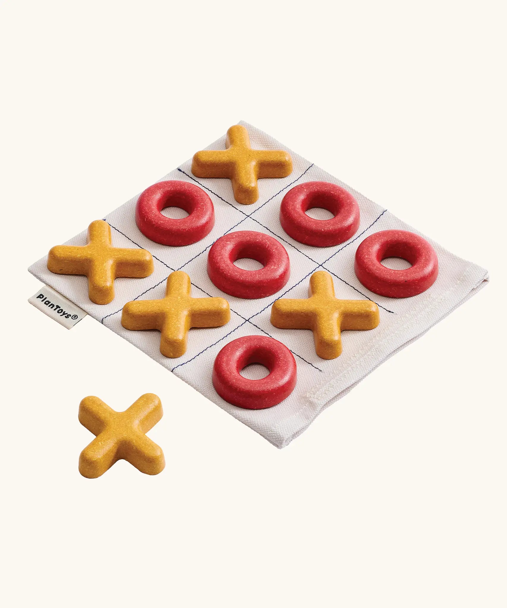 PlanToys Travel Tic-Tac-Toe wooden game set. Cotton storage bag printed with a grid with 5 yellow x pieces and 5 red o pieces.  