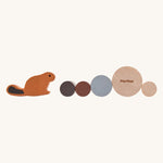 The pieces from the PlanToys Timber Tumble Game on a plain background. 