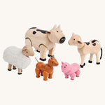 PlanToys Farm Animals Set on a plain background. 
