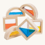 PlanToys wooden sensory Water Blocks on a plain background. The blocks are pictured out of their packaging. 
