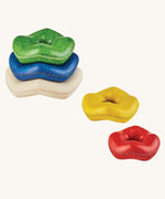 Plan Toys Wave Stacker wooden baby toy with rainbow rings. 