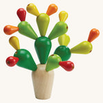 The PlanToys balancing cactus wooden toy on a plain background. 