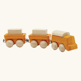 PlanToys yellow wooden cargo train. Three carriage train with magnetic connections that fit on standard toy train tracks. 