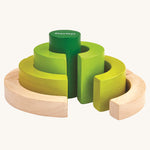 PlanToys Curve Blocks on a plain background. The blocks are pictured out of their packaging. 
