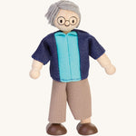 Plan Toys Grandfather Doll on a plain background. 
