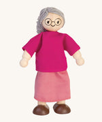 The PlanToys Grandmother Doll on a plain background. 
