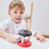 A child playing with the PlanToys Natural Rubberwood Jumping Acrobat Toy. PlanToys have a vast range of sustainable wooden toys are available at Babipur.