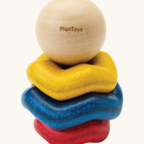 Wooden ring stacking toy for babies by PlanToys. Blue, yellow and red wavy rings with a black and white ball. 