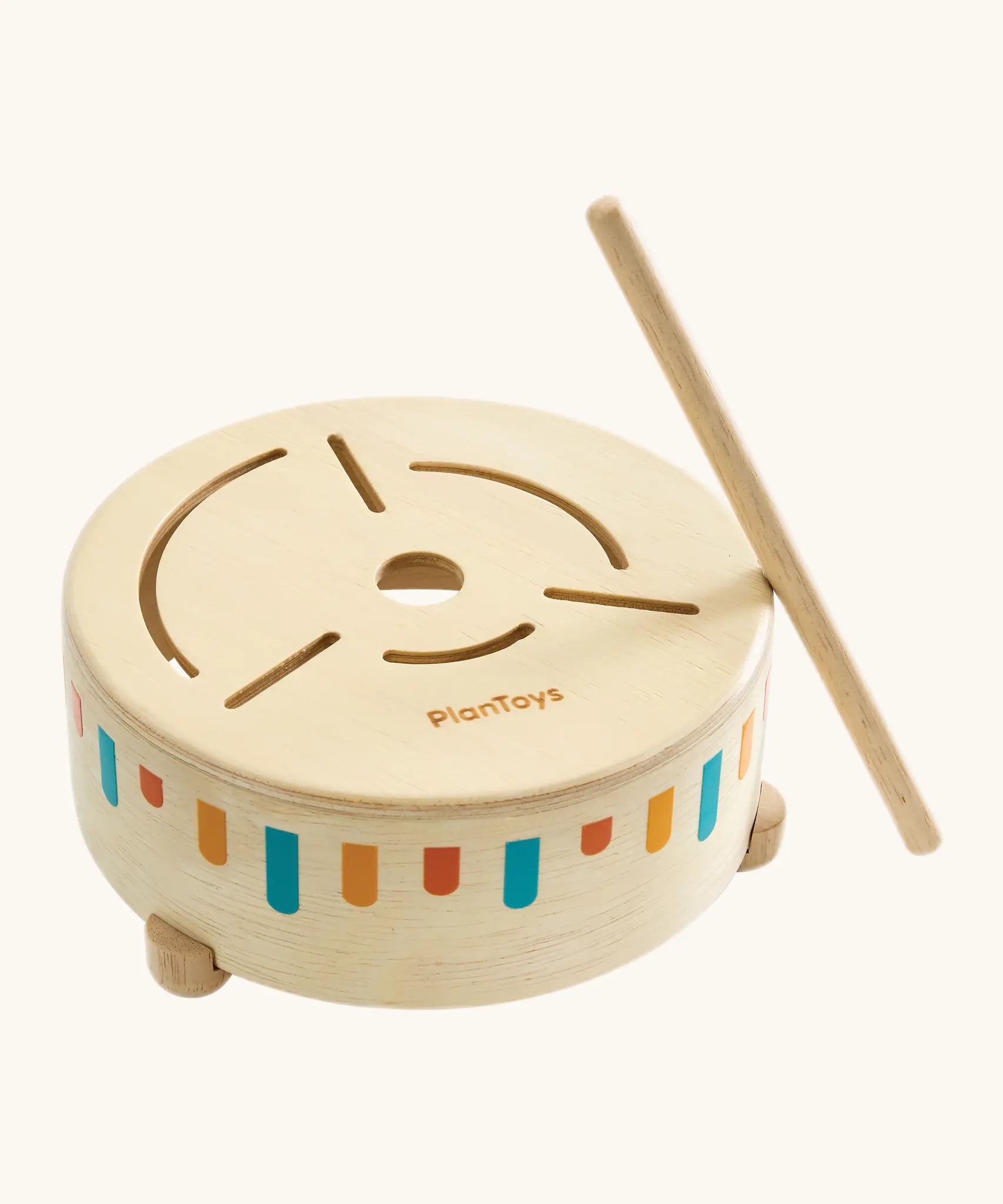 Adult helping a toddler play the wooden sensory drum