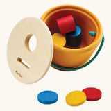PlanToys drop and fit bucket wooden object permanence toy with the lid taken off.