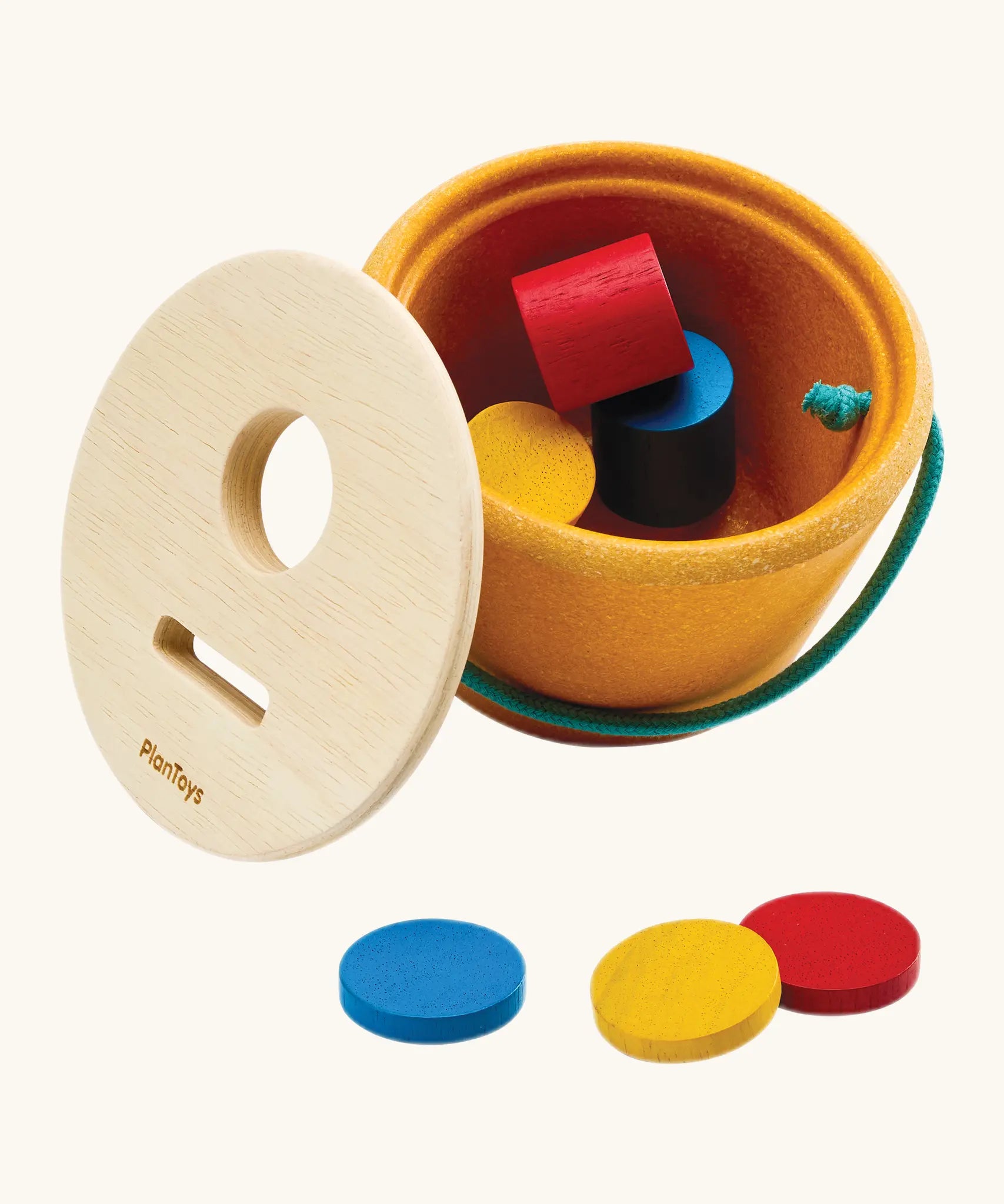 PlanToys drop and fit bucket wooden object permanence toy with the lid taken off.
