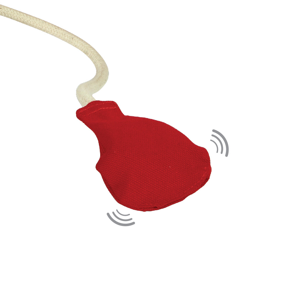 A close up of the squeaky pump on the blood pressure toy from the PlanToys Doctor Set.