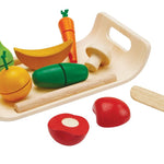 The PlanToys Assorted Fruit & Vegetables Tray play food set including orange