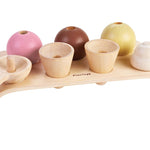 cream topping and scooper. White background.