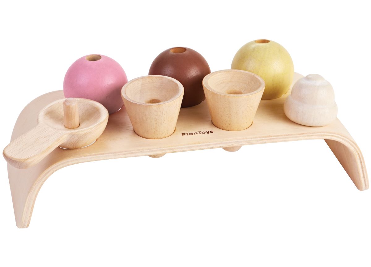 cream topping and scooper. White background.
