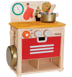 The PlanToys Wooden Play Kitchen Set. with a colourful splashback