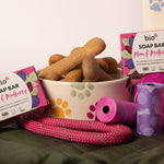 Bio-d natural plum and mulberry solid soap bar next to a dog bowl with biscuits