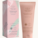 Pink with green leaves postpartum hair growth mask box and a pink tube on a cream background.