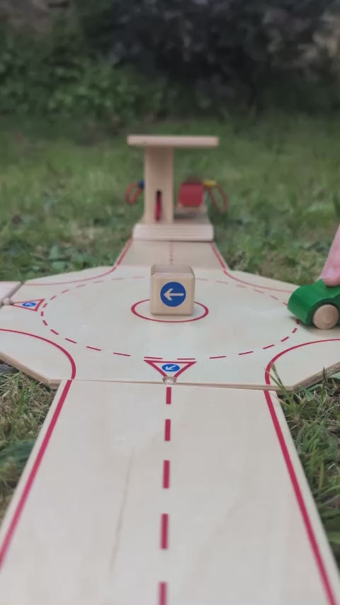 Beck Holzspielzeug Wooden Roundabout Junction for Toy Cars with a sign post and 4 road exits.