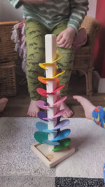 Magic Wood Marble Tree Mini, a wooden Ball Run with rainbow coloured leaves, being played with by children.