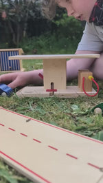 Beck Holzspielzeug Wooden Toy Car Garage Petrol Station with two petrol pumps and a working raised platform for car repairs.