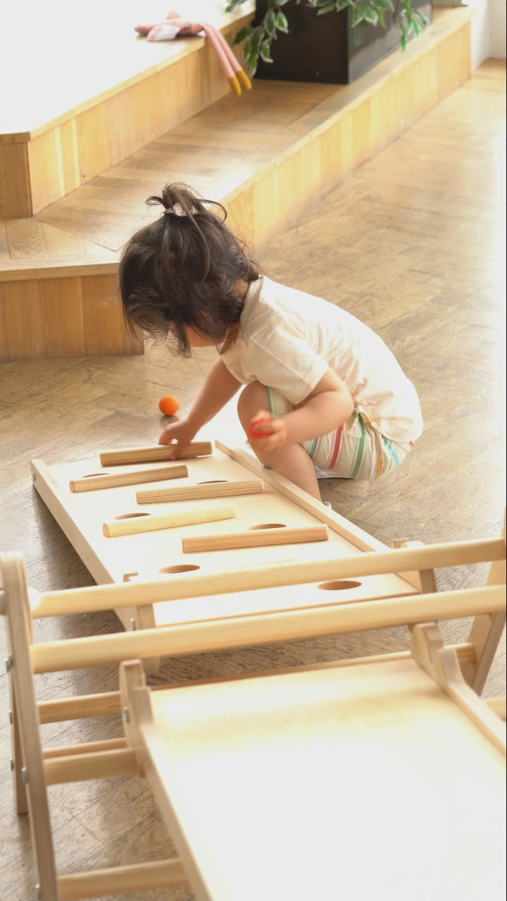 Baby playing with Triclimb Miri Sticks