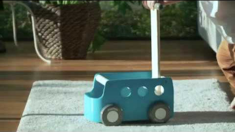 The PlanToys Blue Van Walker in use. 