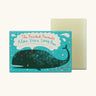 The Printed Peanut aloe vera natural handmade soap bar standing next to it's decorative blue cardboard box showing a whale