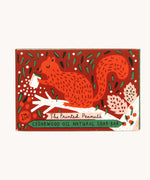 The Printed Peanut cedarwood natural handmade soap shown in it's decorative cardboard box packaging.