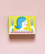 The Printed Peanut Lavender Blossom soap gift box on pink background, lavender oil soap with botanical illustration.