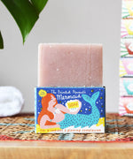 Printed Peanut rose geranium natural soap bar placed on top of the mermaid themed illustrated packaging box.