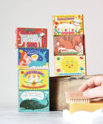 Stack of Printed Peanut illustrated boxes containing natural soaps. 