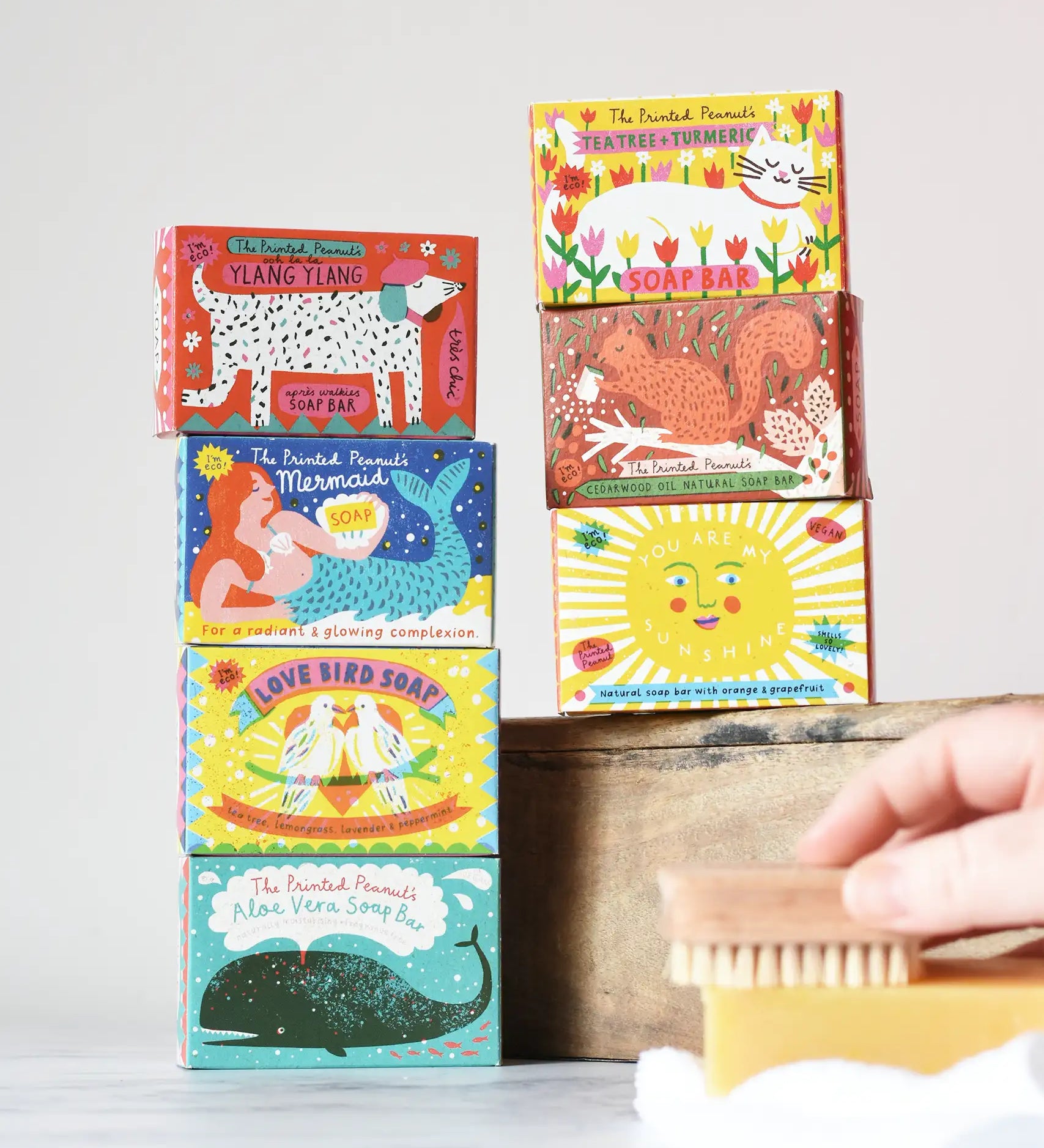 Stack of Printed Peanut illustrated boxes containing natural soaps. 