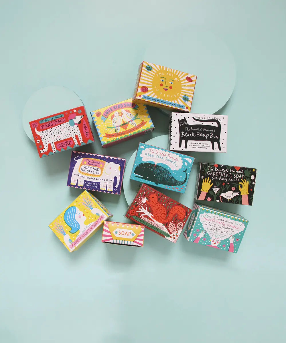 Range of The Printed Peanut handmade gift soaps with different essential oil scents, with illustrated packaging made in the UK.