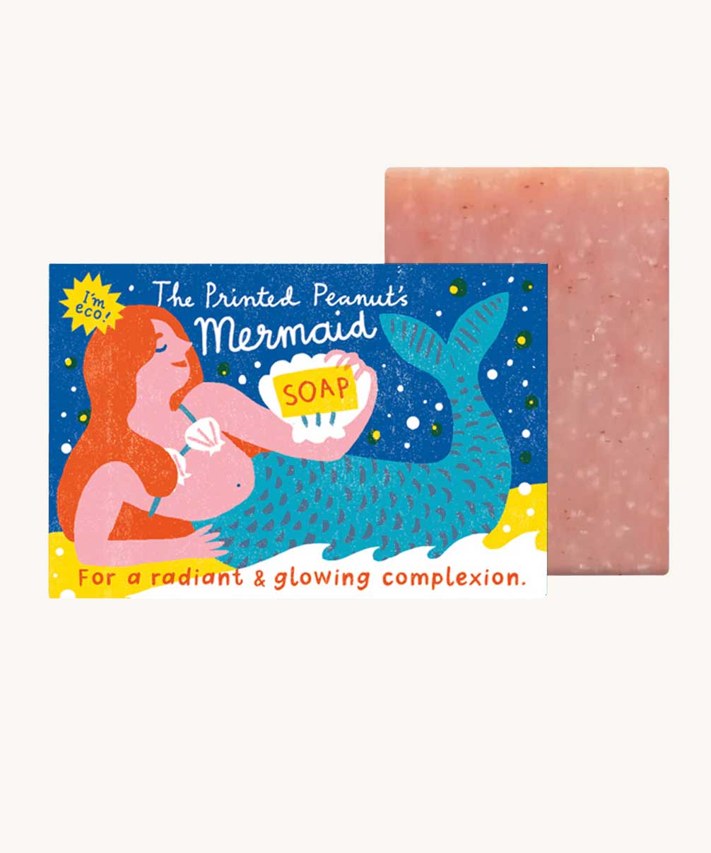 The Printed Peanut mermaid rose natural handmade soap. The decorative packaging box is shown next to the pink bar of soap. 